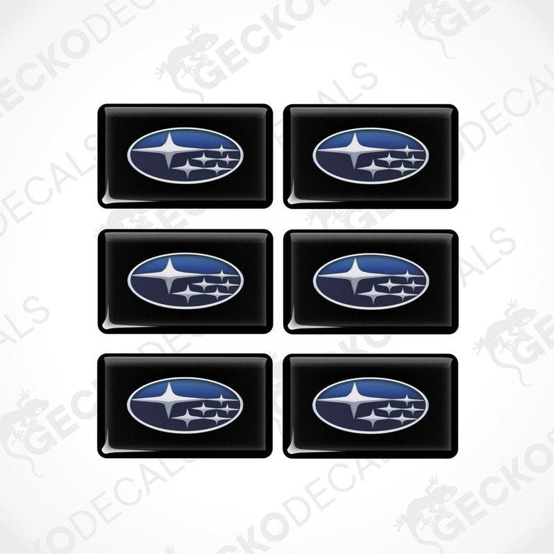 A set of six black, blue, and white vehicle decals featuring the Subaru logo.