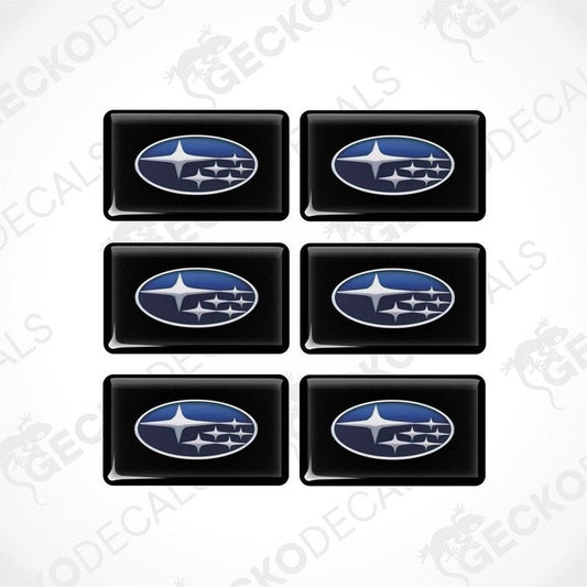 A set of six black, blue, and white vehicle decals featuring the Subaru logo.