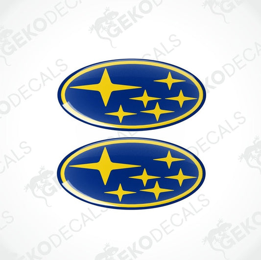Two blue and yellow vinyl decals with Subaru logo design.