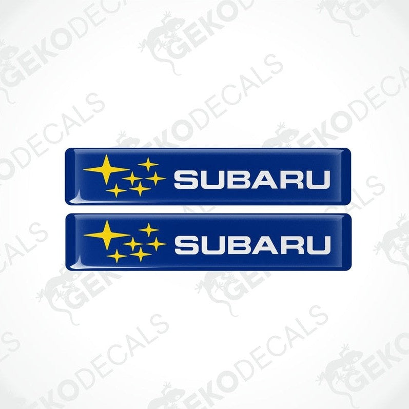 Two blue vinyl stickers with the Subaru brand logo and star graphics.