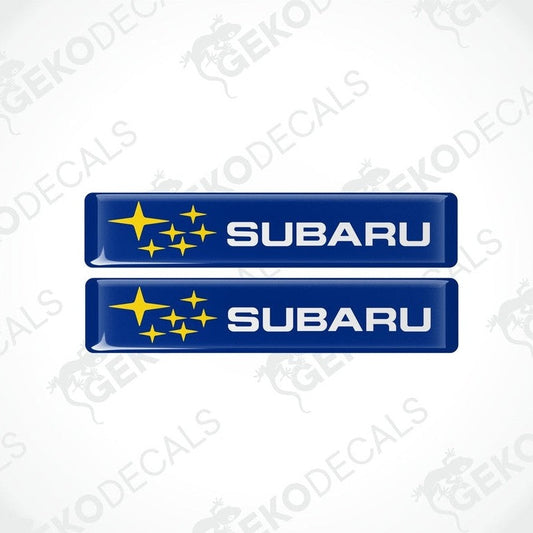 Two blue vinyl stickers with the Subaru brand logo and star graphics.