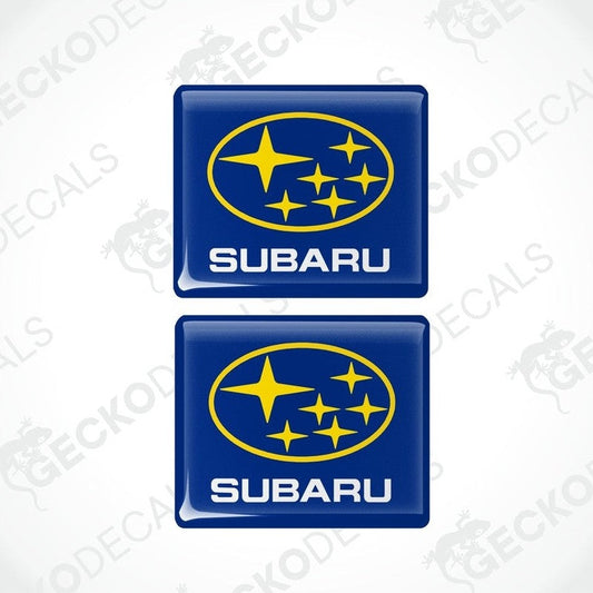 Two blue vinyl stickers with the SUBARU brand logo and stars.