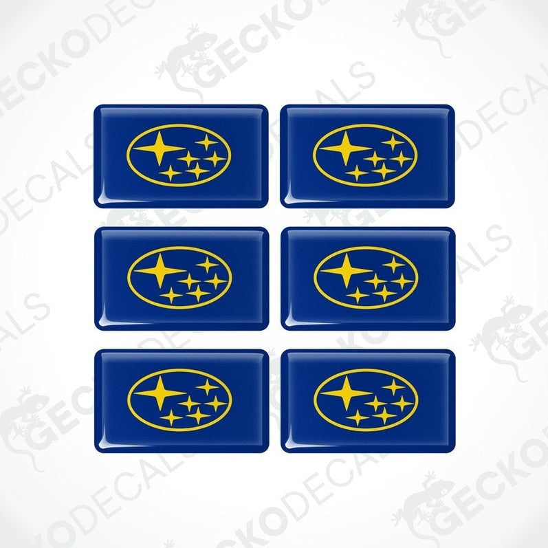 A set of six blue and yellow vehicle decals featuring the Subaru logo.