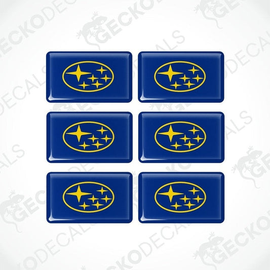 A set of six blue and yellow vehicle decals featuring the Subaru logo.