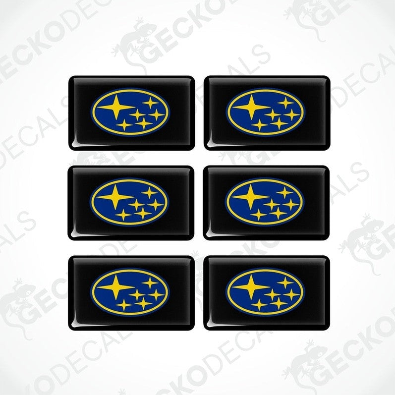 A set of six black, blue, and yellow vehicle decals featuring the Subaru logo.