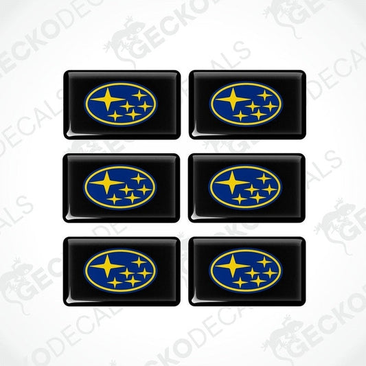A set of six black, blue, and yellow vehicle decals featuring the Subaru logo.