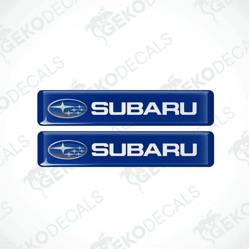 Two blue vinyl decals with the Subaru logo in white.