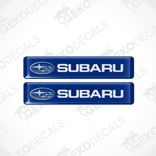 Two blue vinyl decals with the Subaru logo in white.