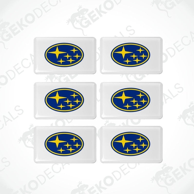 A set of six withe, blue, and yellow vehicle decals featuring the Subaru logo.