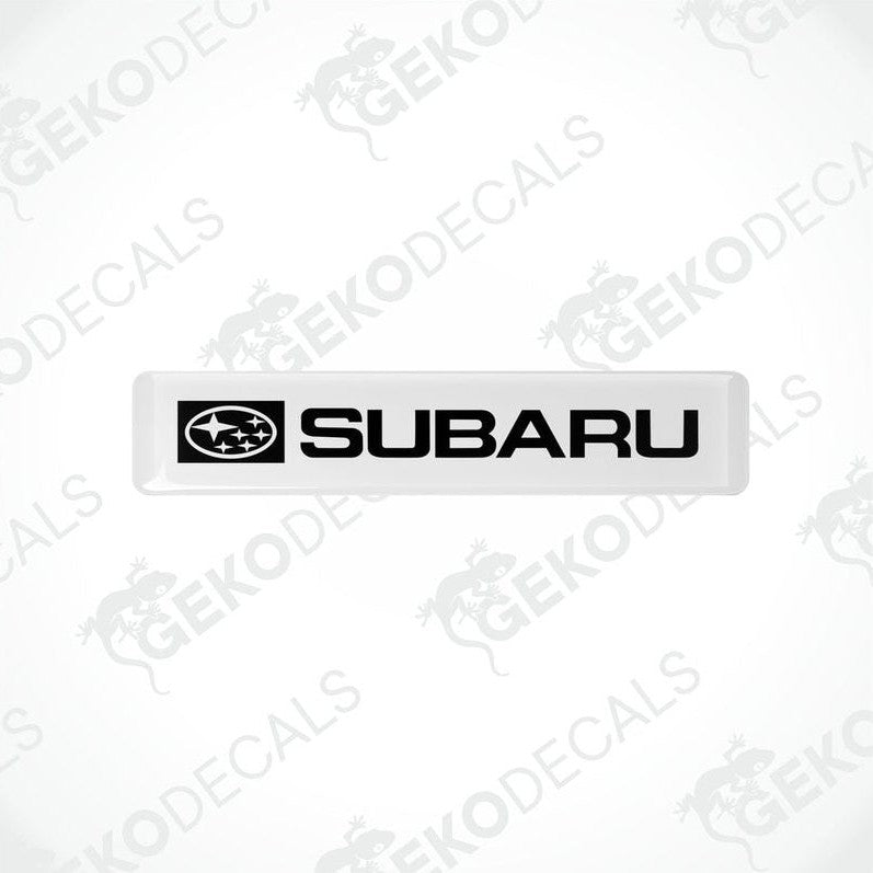  Withe decals with the Subaru car logo and the word 'SUBARU' in white letters.