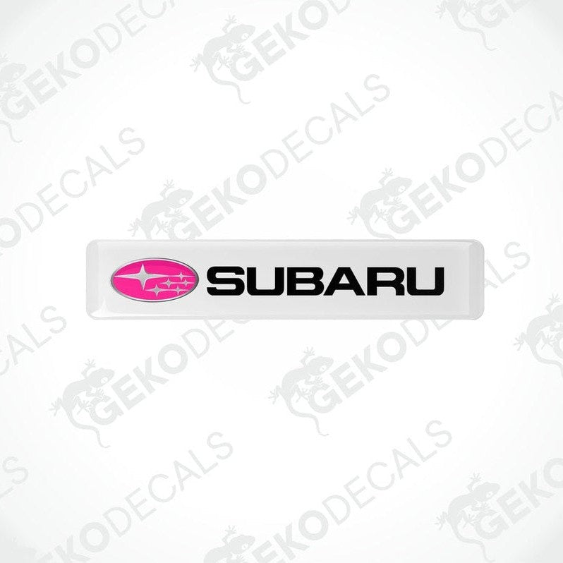  Withe vinyl stickers with the word 'SUBARU' written in white and a pink star symbol on each sticker.