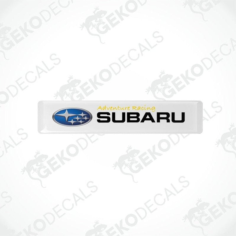 Withe vinyl stickers with the text 'ADVENTURE RACING' and the Subaru logo.