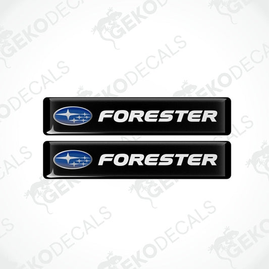 Two black vinyl stickers with the word 'FORESTER' and a graphical representation of a car above the text.