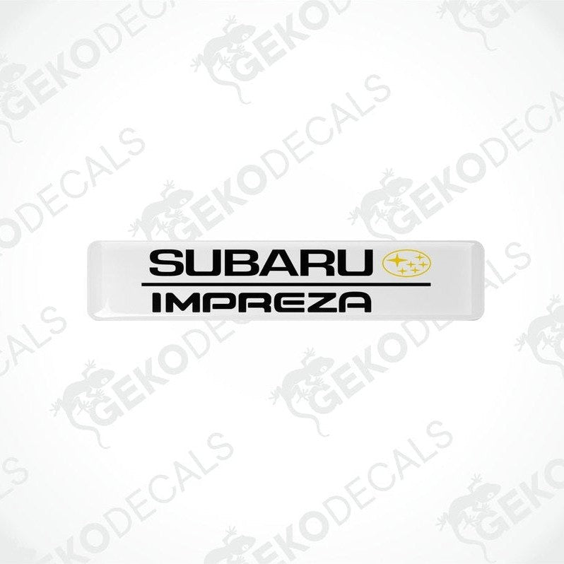 Withe decals with the Subaru car logo and the word 'SUBARU IMPREZA' in yellow letters.