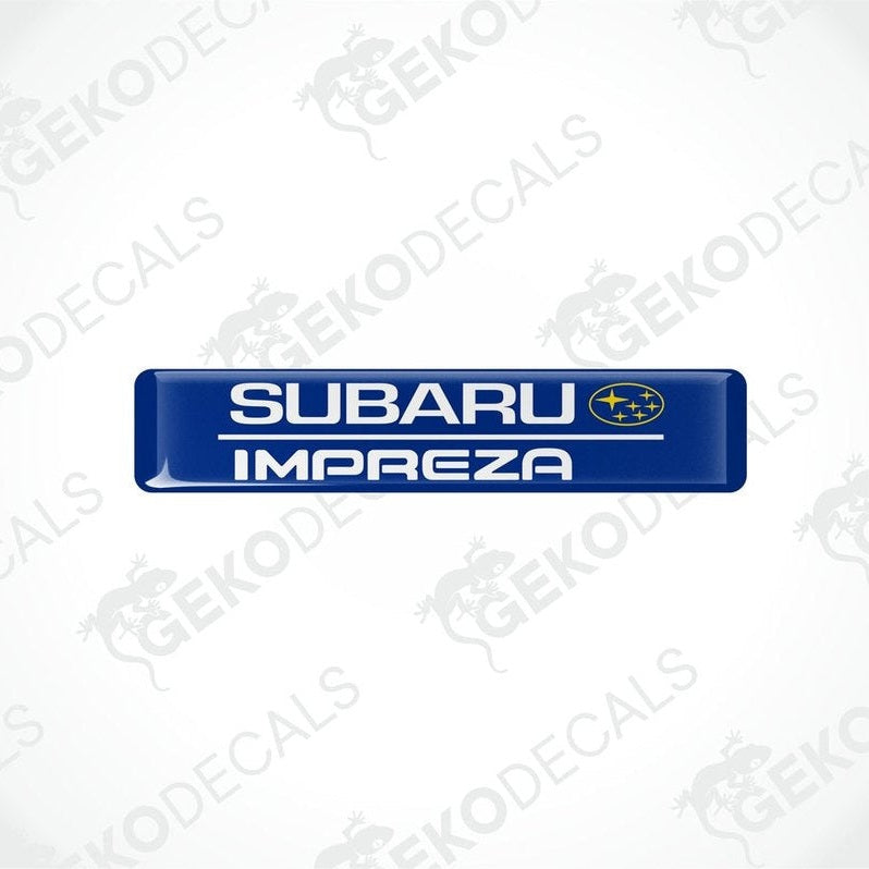  Blue decals with the Subaru car logo and the word 'SUBARU IMPREZA' in yellow letters.