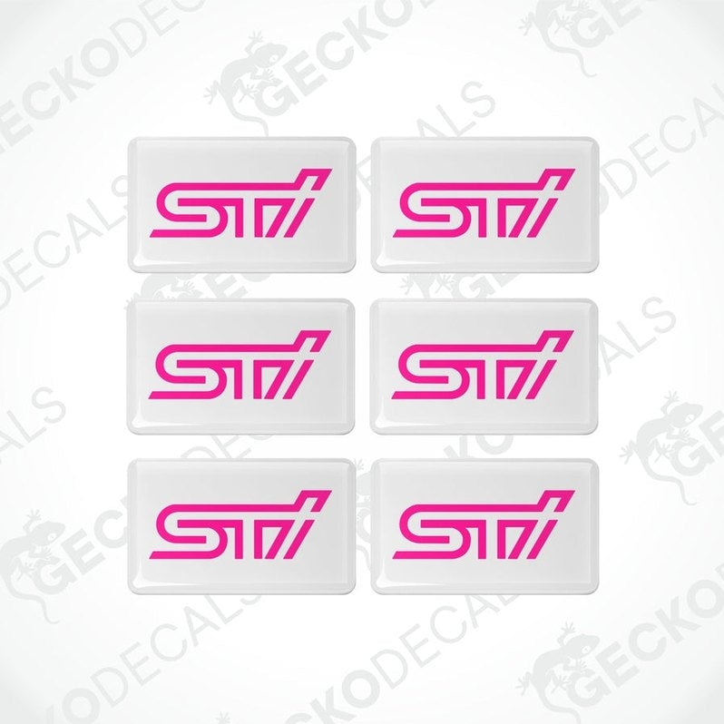 A set of six withe vinyl stickers with the word 'STI' in pink lettering.