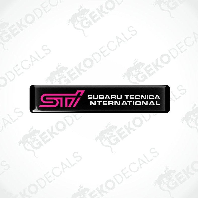  Black decals with pink and white text that read 'STI SUBARU TECNICA INTERNATIONAL'.