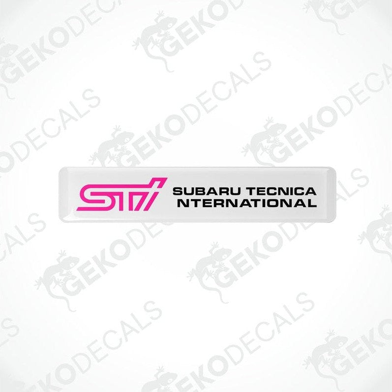 Withe decals with pink and black text that read 'STI SUBARU TECNICA INTERNATIONAL'.