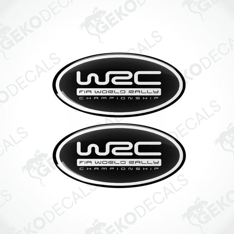 Two oval-shaped black and white vinyl decals with the WRC (World Rally Championship) logo.