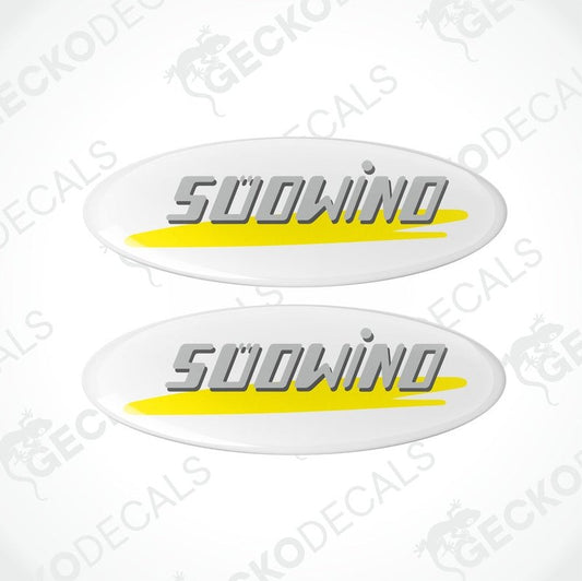 Two white vinyl stickers with the text 'SÜDWIND' in yellow and gray, placed on a white background.