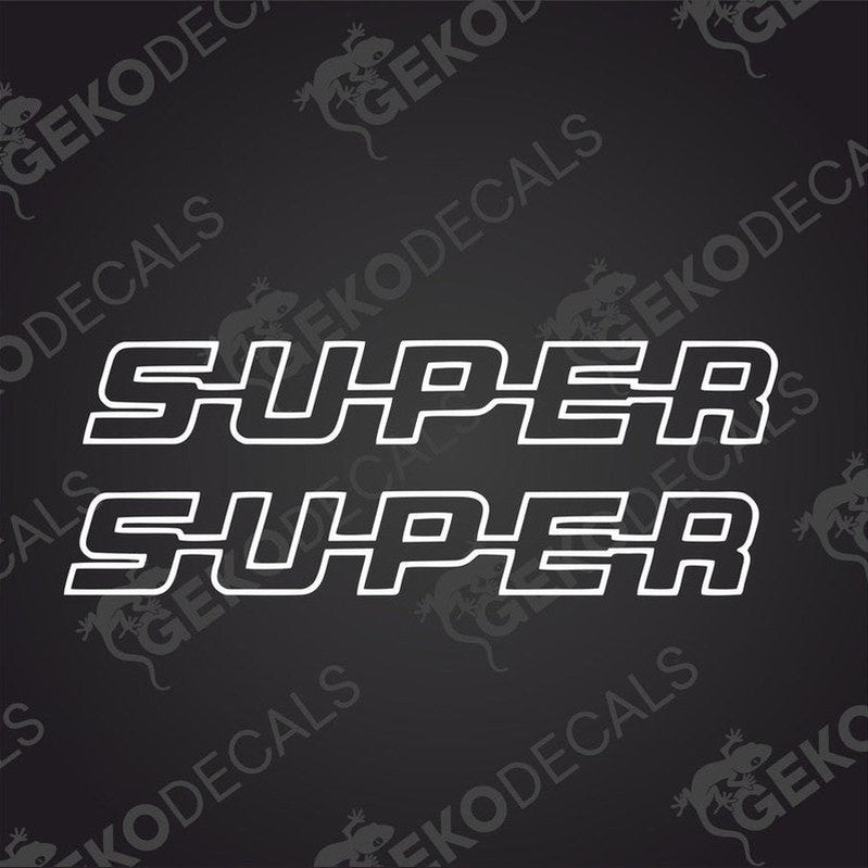 A black die cut sticker with the word 'SUPER' in white capital letters, delivered on a transfer paper with the Gecko Decals logo.