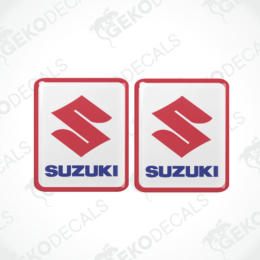 Two red, white, and blue vinyl decals with the SUZUKI logo.