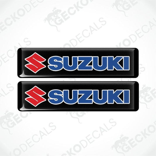 Two Suzuki logos on a white background with 'Gecko Decals' branding.
