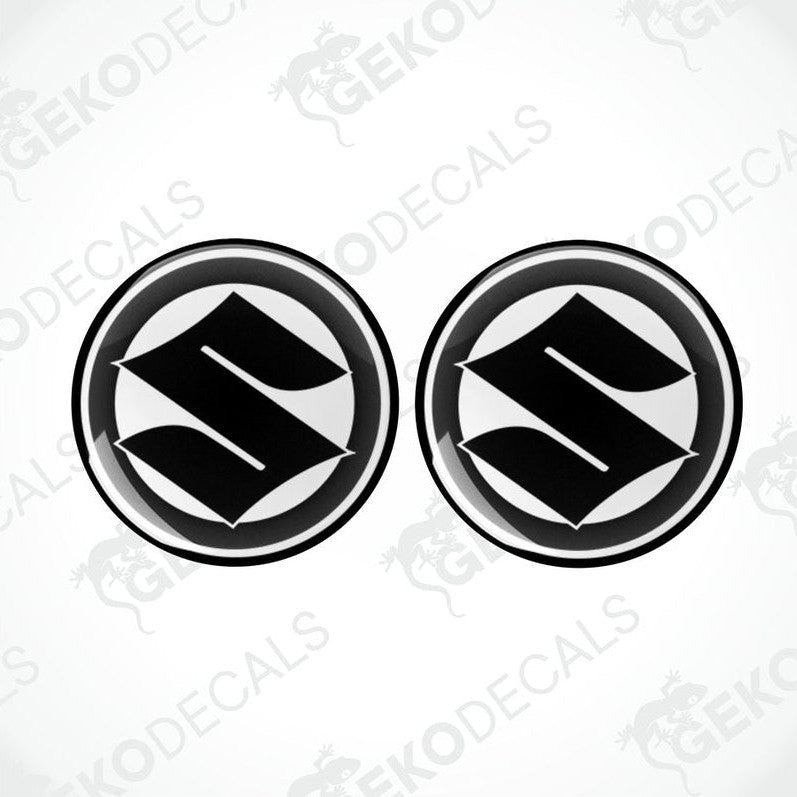 Two black and white vinyl decals with the SUZUKI logo.
