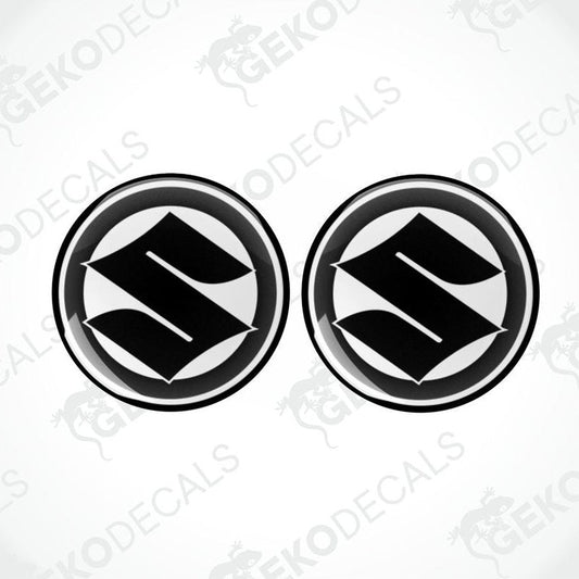 Two black and white vinyl decals with the SUZUKI logo.