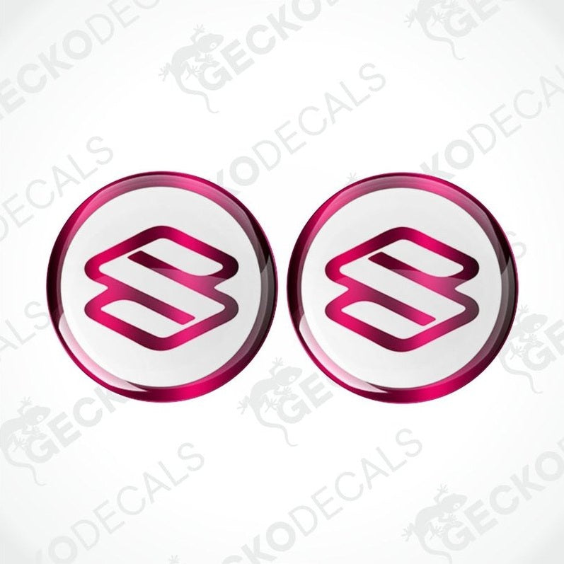 Two pink and white Suzuki logos on a white background with 'Gecko Decals' branding.