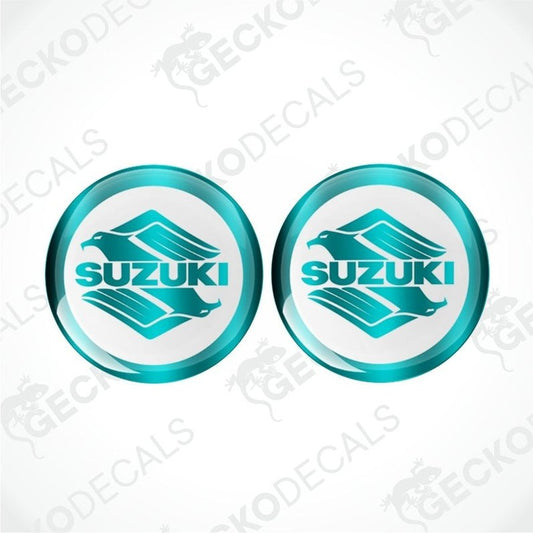 Two Suzuki logos in circular designs on a white background with 'Gecko Decals' watermark.