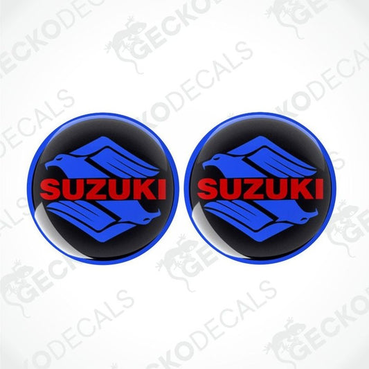 Two Suzuki logos with blue and red design on a white background with 'Gecko Decals' watermark.