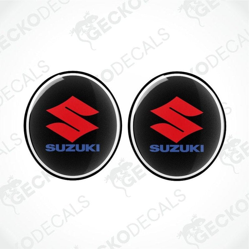 Two Suzuki logos on a white background with 'Gecko Decals' branding.
