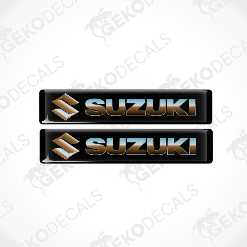 Two black vinyl stickers with the SUZUKI brand logo in white and blue.
