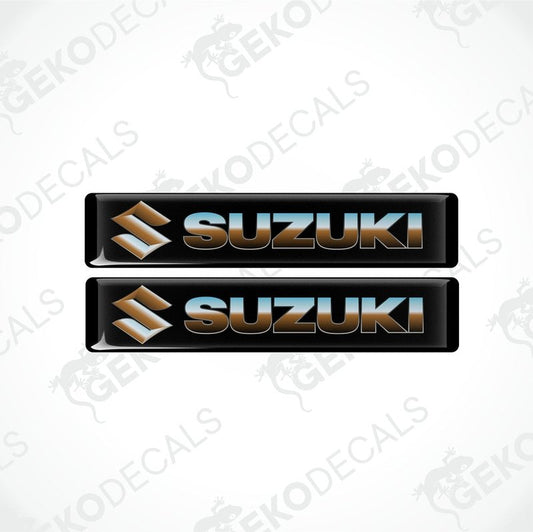 Two black vinyl stickers with the SUZUKI brand logo in white and blue.