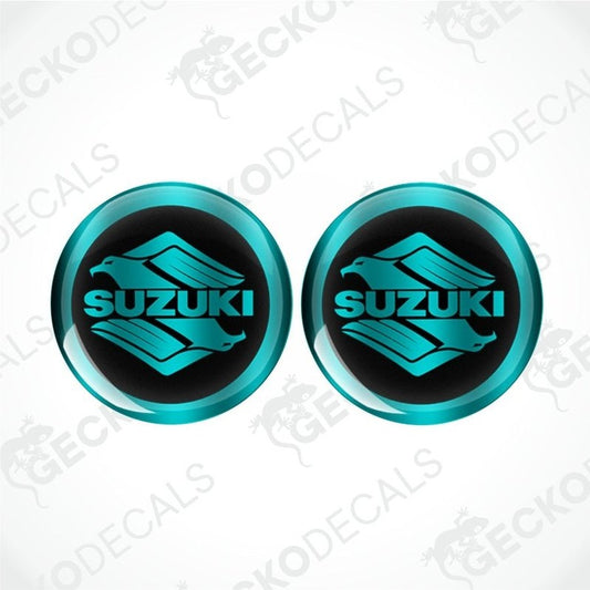 Two turquoise Suzuki logos on a white background with 'Gecko Decals' branding.