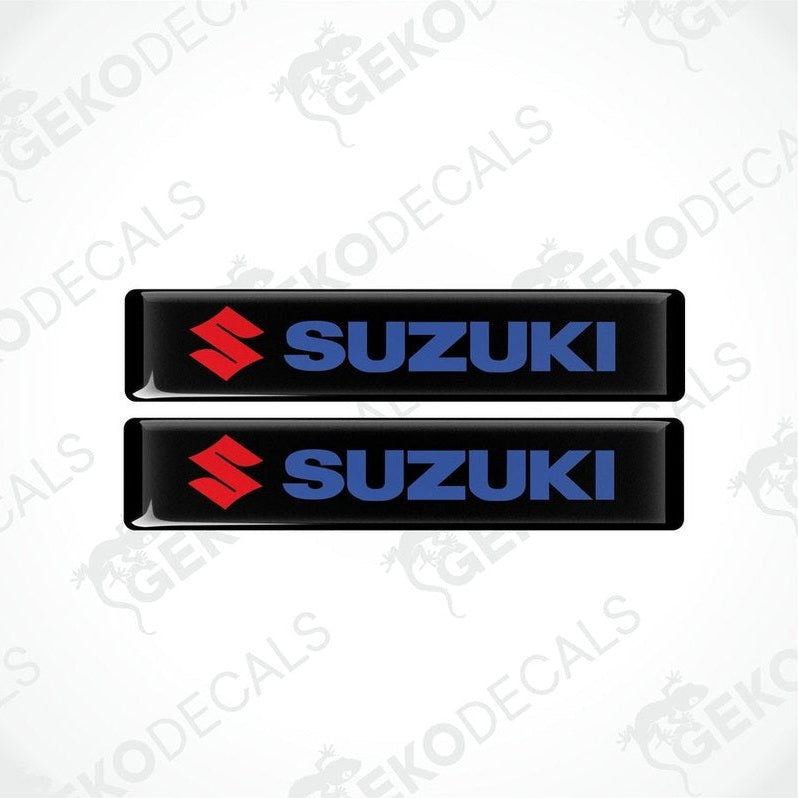 Two black vinyl stickers with the SUZUKI logo in blue and red.