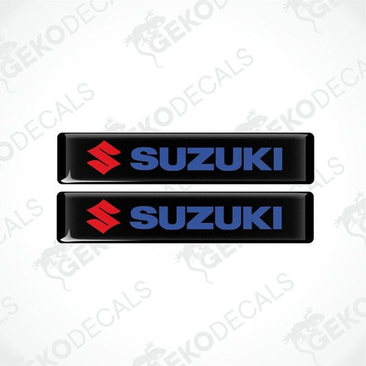 Two black vinyl stickers with the SUZUKI logo in blue and red.
