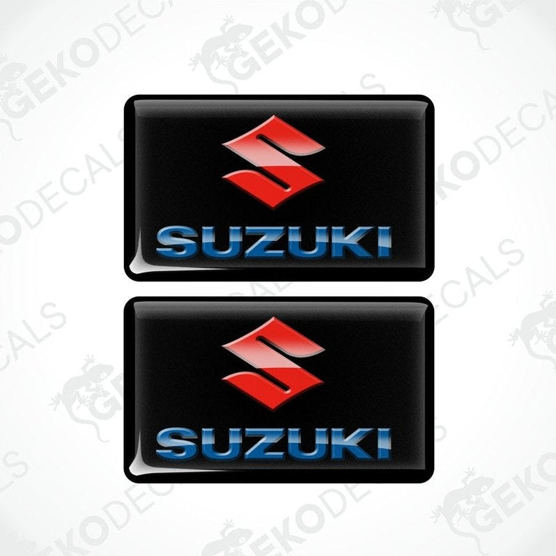 Two black vinyl stickers with the SUZUKI logo in blue and red.