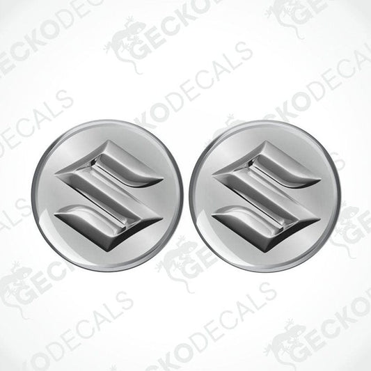 Two metallic Suzuki logos on a white background with 'Gecko Decals' branding.