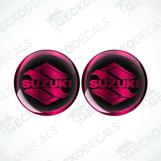 Two pink Suzuki logos on a white background with 'Gecko Decals' branding.