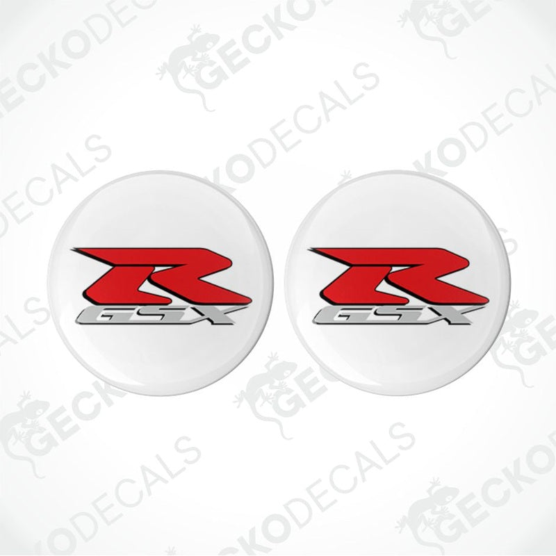 Two white circular decals with red and black 'R' logo on a white background.