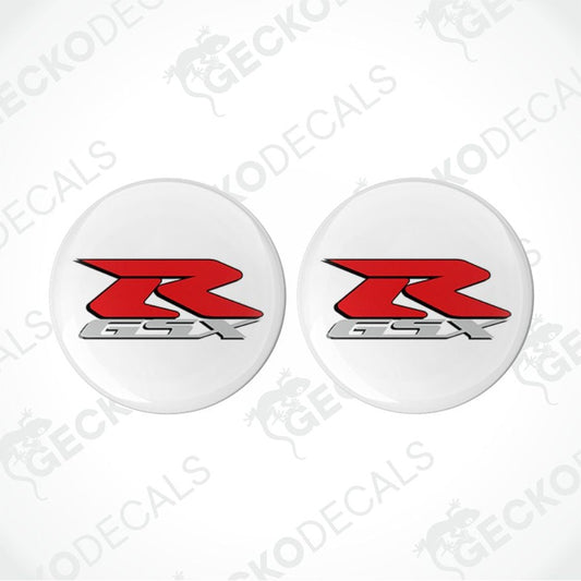 Two white circular decals with red and black 'R' logo on a white background.