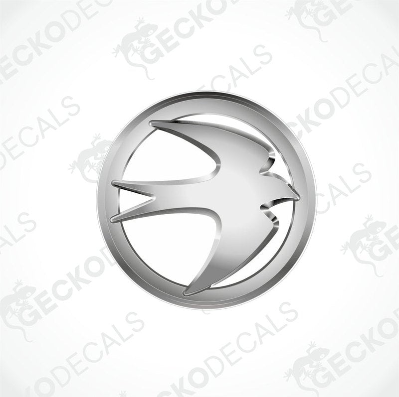 A silver emblem or decal with a geometric design, likely representing a caravan brand.