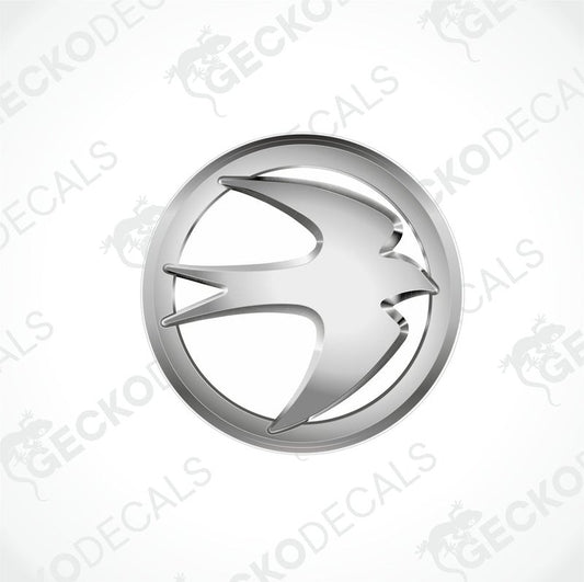 A silver emblem or decal with a geometric design, likely representing a caravan brand.