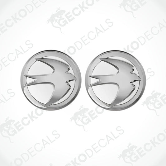 Two silver vinyl stickers with a geometric pattern and a glossy finish, displayed on a white background.