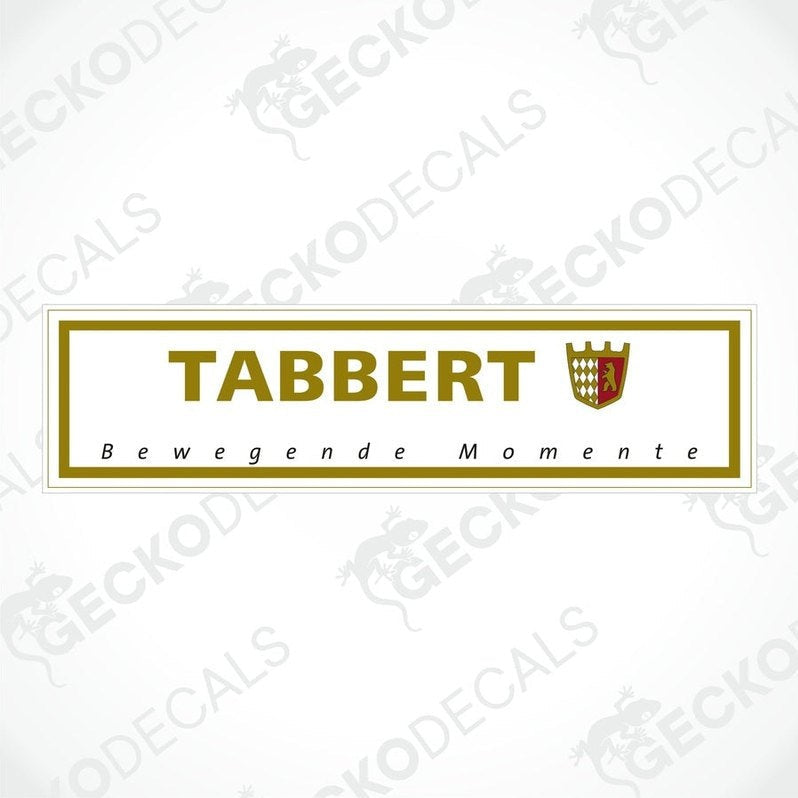 A rectangular sticker with the brand name 'TABBERT' and the slogan 'Bewegende Momente' in bold lettering, predominantly gold and white in color, with a shield emblem above the text.