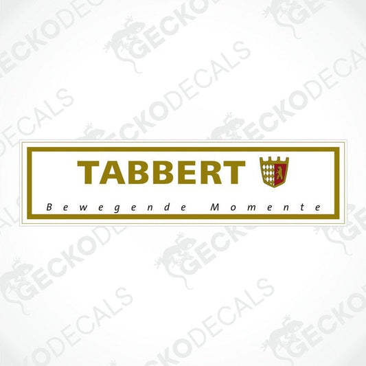 A rectangular sticker with the brand name 'TABBERT' and the slogan 'Bewegende Momente' in bold lettering, predominantly gold and white in color, with a shield emblem above the text.