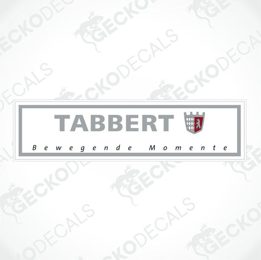 A rectangular white sticker with the brand name 'TABBERT' and the slogan 'Bewegende Momente' printed in black and red on the lower part.