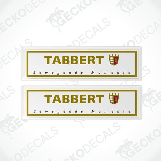 Two white vinyl stickers with the text 'Tabbert Beweegende Momente' and a coat of arms symbol, with a GeckoDecals watermark on the bottom right.